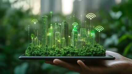 Hand holding tablet green city model wireless network symbols symbolizing integration smart city technology sustainability digital infrastructure eco-conscious urban development