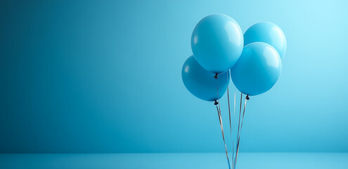 Blue balloons for celebration. Four blue balloons uplifted against a bright blue background for a festive celebration or event decor