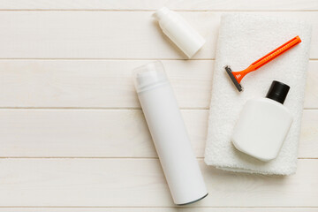 shaving man set. shaving machine, towel, lotion and shaving foam on colored background. Men bath Accessories top view