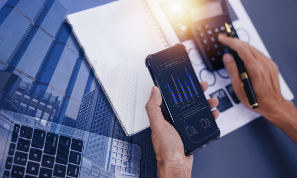 Double exposure of Professional person with digital smartphone and financial analysis report and Digital Marketing Concept.