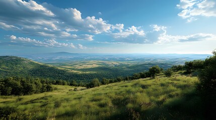 Obraz premium Serene Landscape with Rolling Hills and Lush Greenery Under Clouds