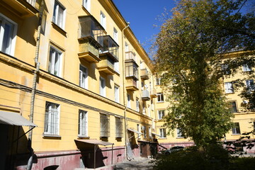 Fototapeta premium Architecture of old Soviet Union houses in Stalin's Empire style. Exterior of the facade of a vintage residential building in Russia