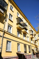 Obraz premium Architecture of old Soviet Union houses in Stalin's Empire style. Exterior of the facade of a vintage residential building in Russia