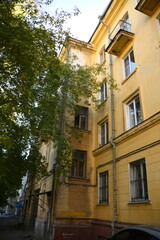 Architecture of old Soviet Union houses in Stalin's Empire style. Exterior of the facade of a vintage residential building in Russia