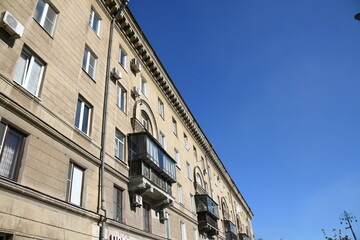 Architecture of old Soviet Union houses in Stalin's Empire style. Exterior of the facade of a vintage residential building in Russia