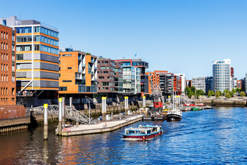 Buildings in HafenCity Sandtorhafen harbor with boats in Hamburg, Deutschland