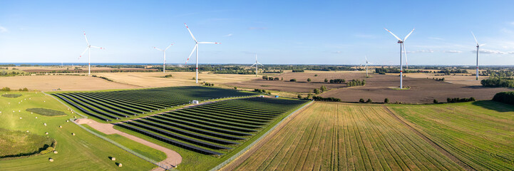 Wind and solar park turbine renewable energy power aerial view photo panorama at the Baltic Sea near Heiligenhafen, Germany