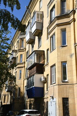 Architecture of old Soviet Union houses in Stalin's Empire style. Exterior of the facade of a vintage residential building in Russia