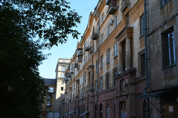 Architecture of old Soviet Union houses in Stalin's Empire style. Exterior of the facade of a vintage residential building in Russia