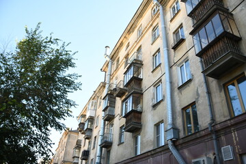 Architecture of old Soviet Union houses in Stalin's Empire style. Exterior of the facade of a vintage residential building in Russia