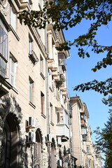 Architecture of old Soviet Union houses in Stalin's Empire style. Exterior of the facade of a vintage residential building in Russia