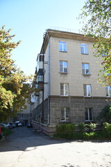 Architecture of old Soviet Union houses in Stalin's Empire style. Exterior of the facade of a vintage residential building in Russia