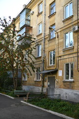 Architecture of old Soviet Union houses in Stalin's Empire style. Exterior of the facade of a vintage residential building in Russia