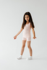people, children, pajama party. Girl in pajamas dancing on white background