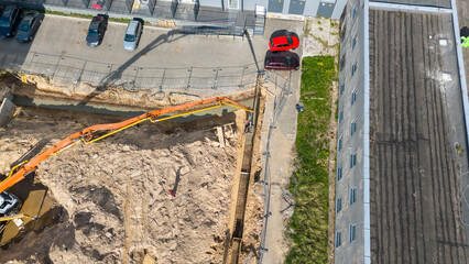 Aerial View of Construction Site with Excavator