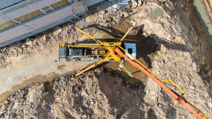 Aerial View of Construction Site with Concrete Pump Truck