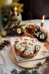 Cinnabon with marshmallows, buttercream and nuts on a festive table, Scandinavian style, Scandinavian Christmas