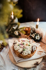 Cinnabon with marshmallows, buttercream and nuts on a festive table, Scandinavian style, Scandinavian Christmas