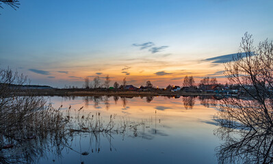 Calm lake with a beautiful sunset in the background