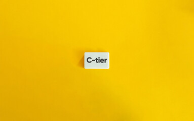 C-tier Banner. Text on Block Letter Tile on Yellow Background. Minimal Aesthetic.