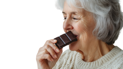 Senior Woman Indulging in a Piece of Dark Chocolate: A Picture of Enjoyment and Wellness.