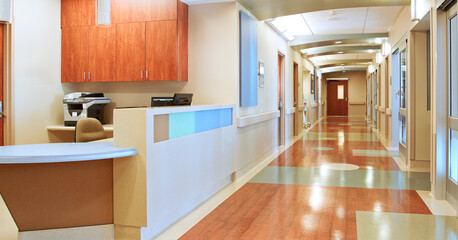 Empty Corridor And Nurse Station Desk In Modern Hospital Building