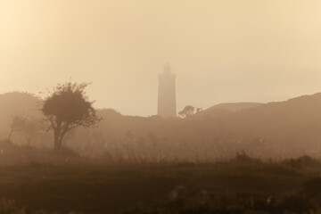 Lighthouse of Rubjerg Knude at sunset. Denmark north sand hills.