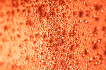Close Up of Condensation Floating Liquid Water Bubbles and Drips on Glass from Rain