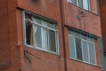 Russian missile hits residential building in Dnipro, Ukraine. Aftermath of enemy attack on city. Destroyed residential multi-story building. Close-up. War. Aftermath of explosion.