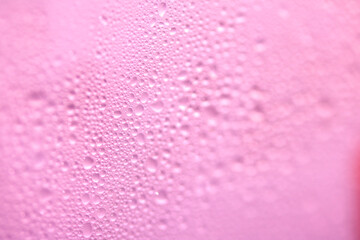 Close Up of Condensation Floating Liquid Water Bubbles and Drips on Glass from Rain