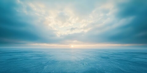 Obraz premium Large body of water with a cloudy sky in the background