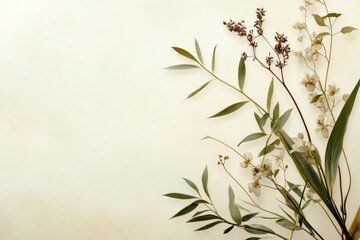 Naklejka premium Botanical arrangement with delicate flowers and green leaves against a soft background