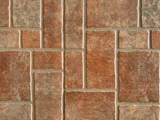 Close up of natural red tiles with random rectangular and square pattern. Geometric random size...