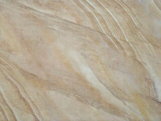 Close up of beige and brown color marble tiles with random dark veins. Seamless marble tiles background texture.