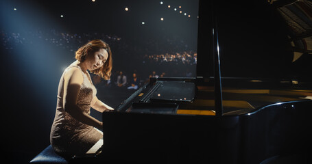 Female Composer Pours Her Soul Into the Grand Piano, Filling the Venue With Expressive Notes. Stage...