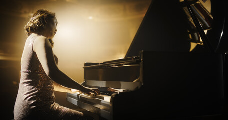 Emotional Female Performing Classical Instrumental Music on Stage. Asian Musician Using a Grand...