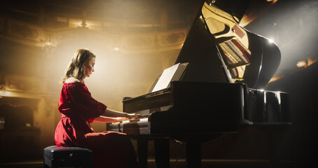 Female Pianist Playing Academic Music, Performing Classical Compositions on Stage. Grand Piano...