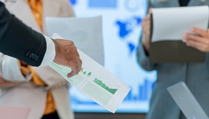 A business meeting about graphs and charts.