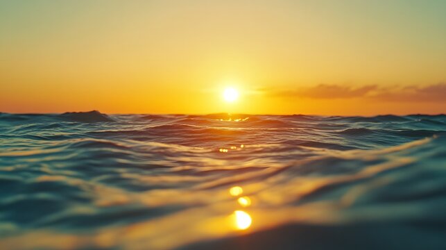 Sunset blurred horizon with warm colors and ocean reflections