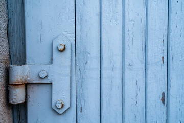 Old hinge on a garage door as a background.