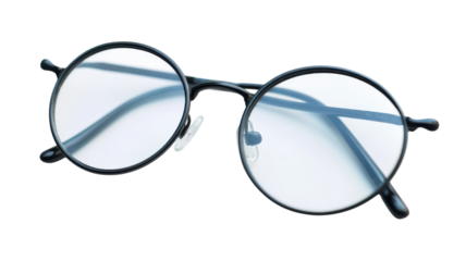 Antique Reading Glasses with Thin Metal Frame Perfect for Vintage-Themed Photography and Historical Representations.