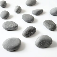 Natural gray stones adorn a white surface.