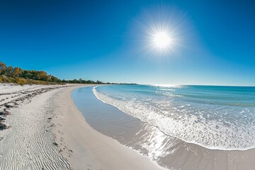 Fototapeta premium The sun's rays create a stunning shine in the sky as they illuminate the bright ocean.