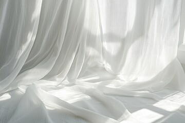 Obraz premium Bright rays of sunlight filter into the house through a sheer white curtain on a hot summer afternoon.
