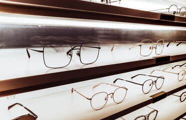 Eyeglasses selection displayed on optical eyewear store shelves