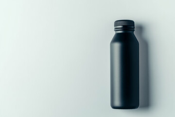Isolated steel thermo water bottle against a white backdrop. Reusable bottle container for tea or coffee. Travel tumbler with Thermos. Sport thermos black stainless steel water flask.