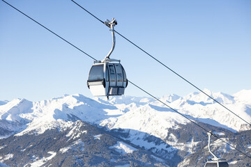 White cable car in a ski resort in the Austrian Alps. Gastein valley