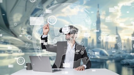Smart project manager sharing marketing idea while sitting at table with laptop while wearing virtual reality glasses. Skilled businessman looking and checking at financial chart floating. Apparatus.