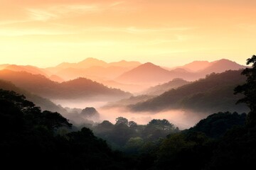 Fototapeta premium Majestic mountain landscape at sunset with misty valleys and golden sky