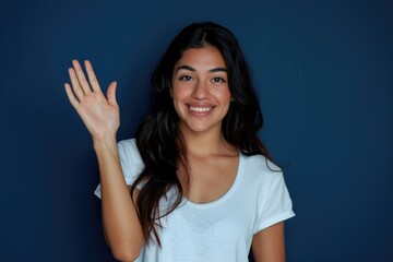 Fototapeta premium Confident young Latin woman in casual white t shirt walking.